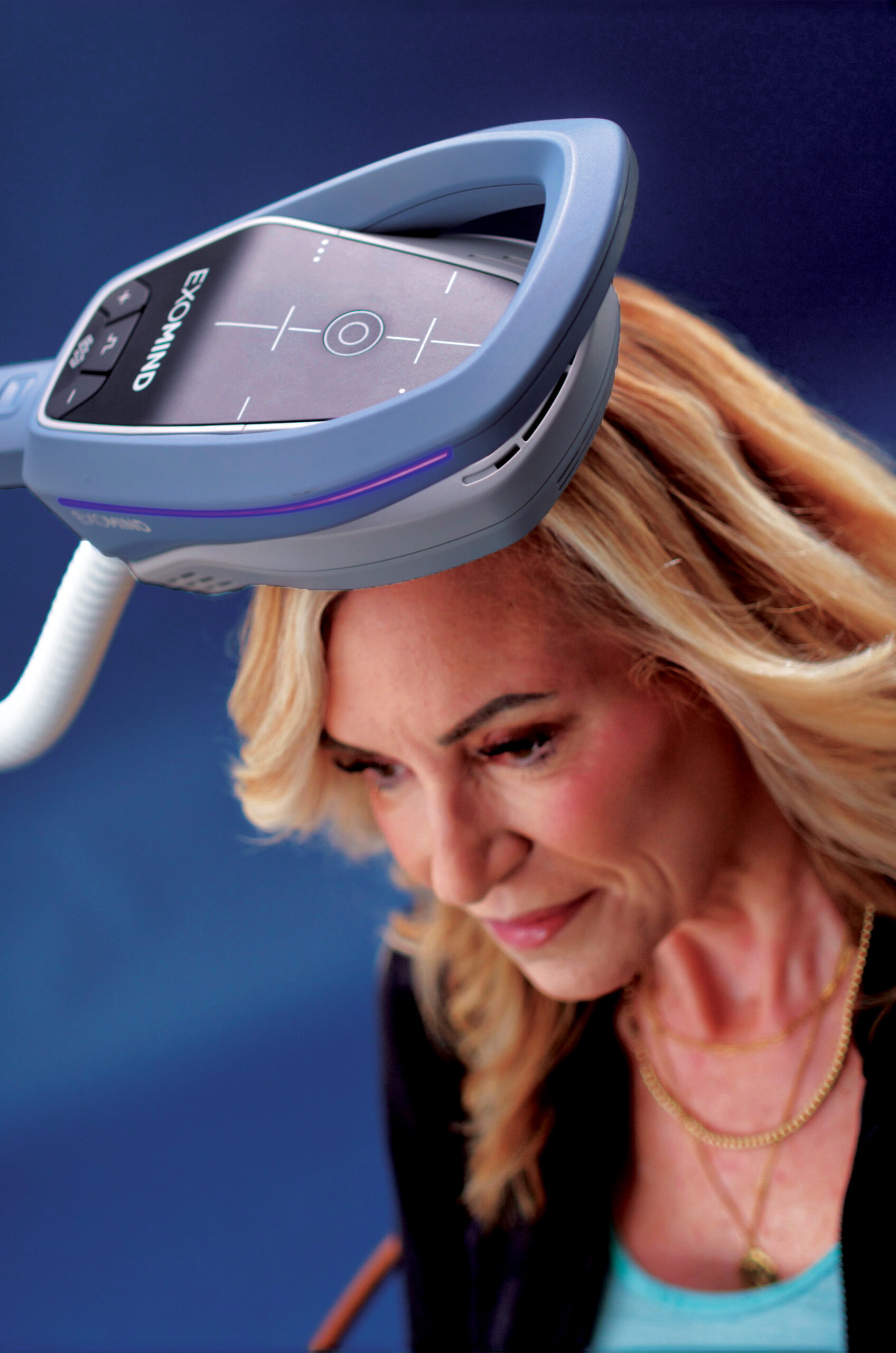 Woman patient using Exomind machine